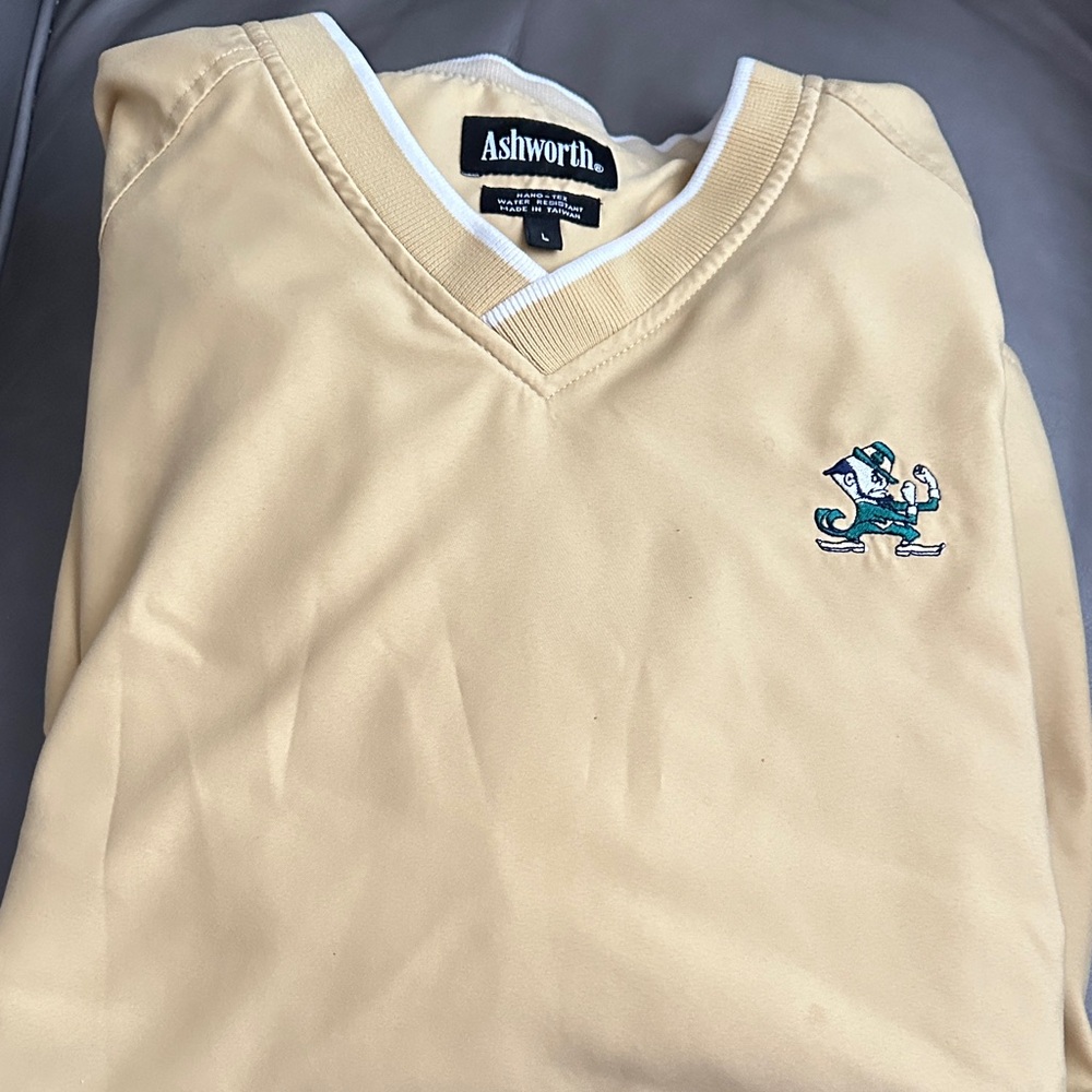 Ashworth Men's Gold V-Neck wind shirt.